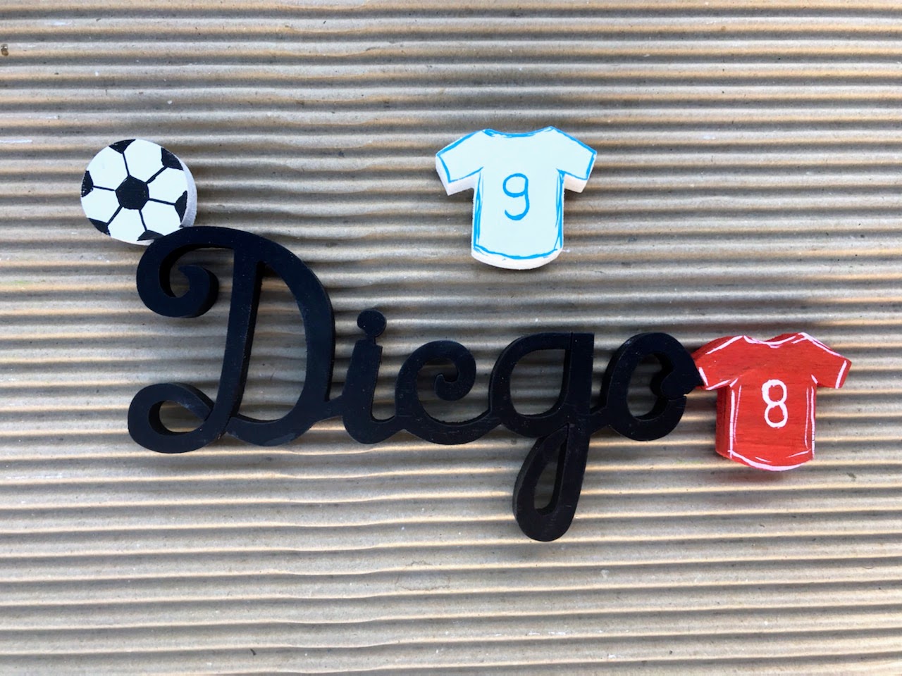 Diégo Noir - Maillot Rouge - L:25cm-H:12cm